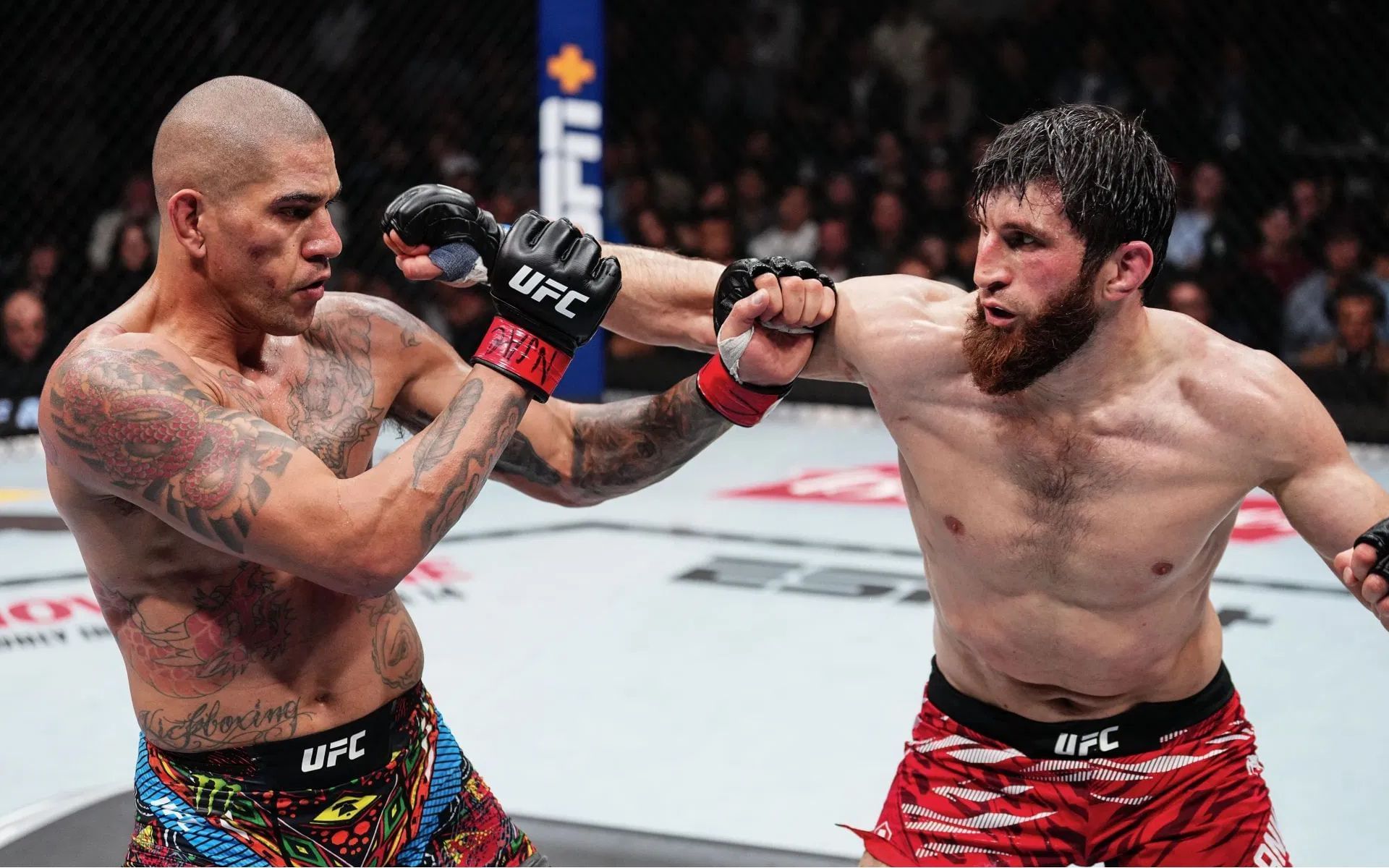 Alex Pereira (left) mocks Magomed Ankalaev (right). [Image courtesy: Getty]