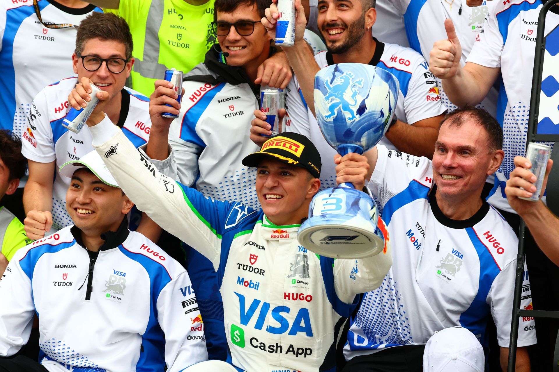 Ayumu Iwasa (L), Isack Hadjar, and Alan Permane (R) during the post-race celebrations after Hadjar&#039;s podium during the 2025 Dutch GP - Source: Getty