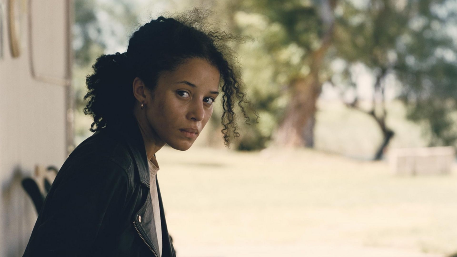 Chase Infiniti as Willa Ferguson in One Battle After Another reflecting on the challenges ahead. (Image via Warner Bros)