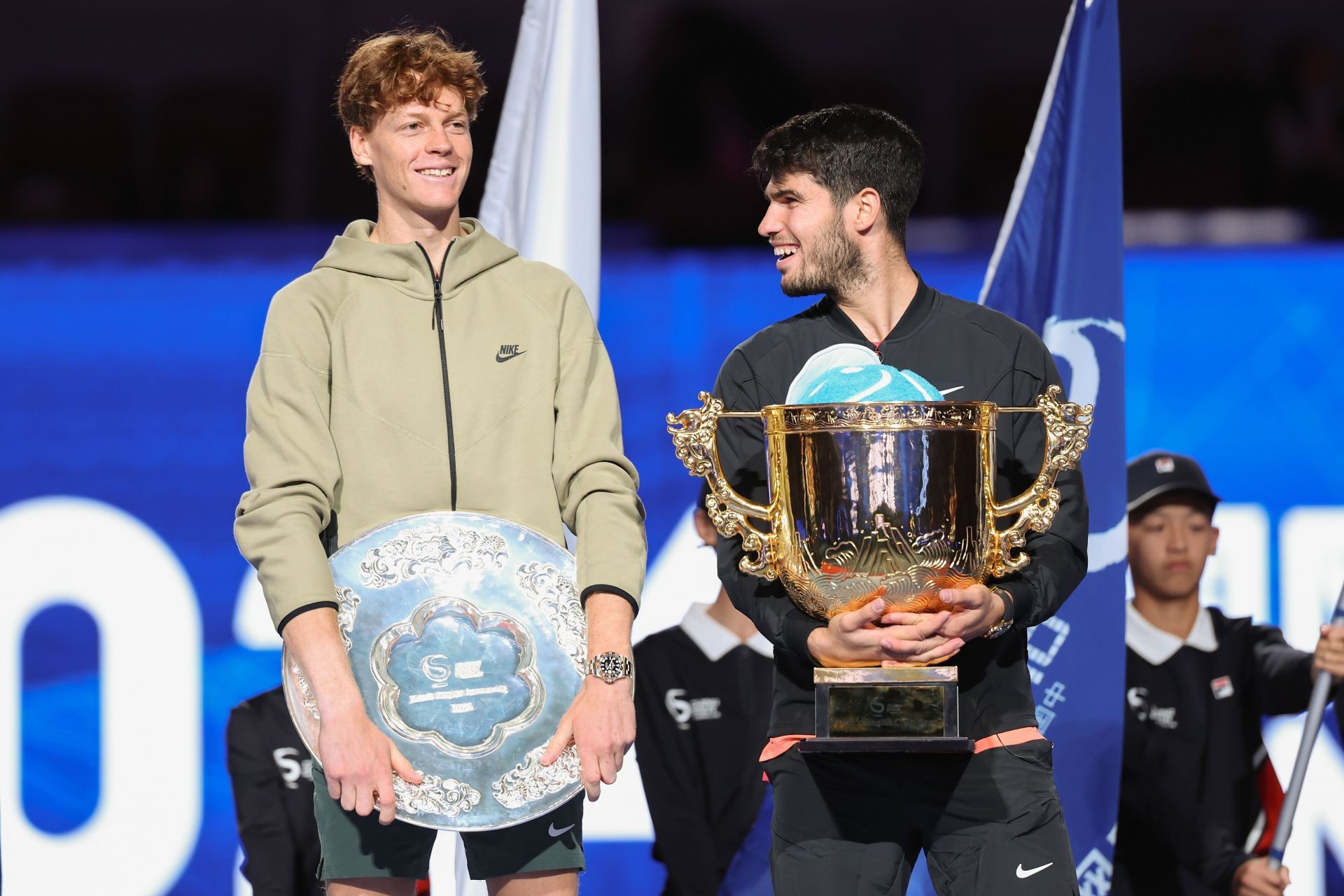 Jannik Sinner (left) and Carlos Alcaraz (right) pose with their men&#039;s singles runner-up and winner&#039;s trophies respectively at the 2024 China Open (Source: Getty)