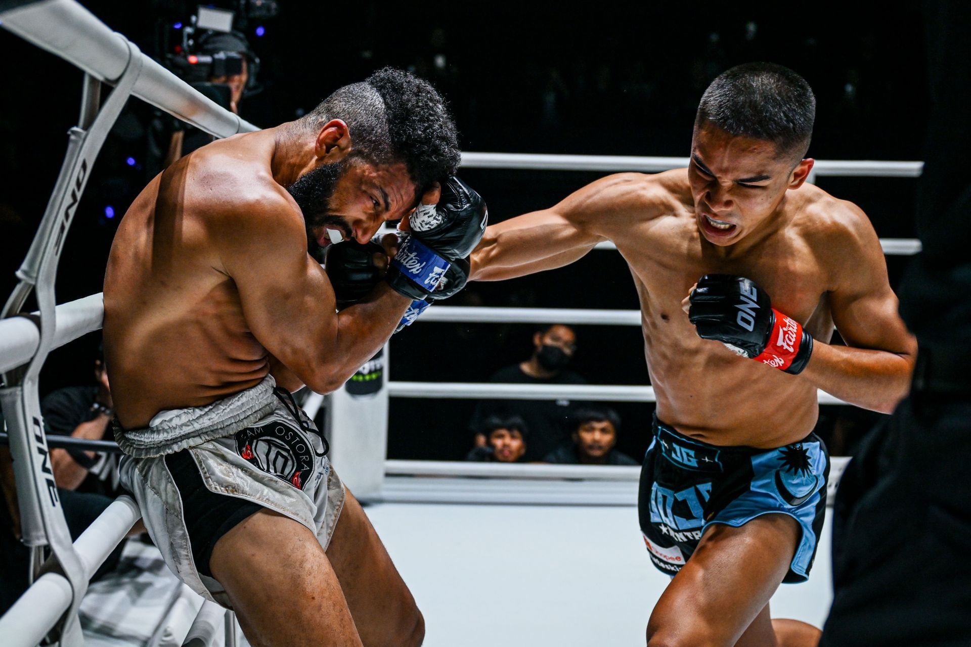 Johan Ghazali (right) stings Zakaria El Jamari with a right fist. [Image: ONE Championship]