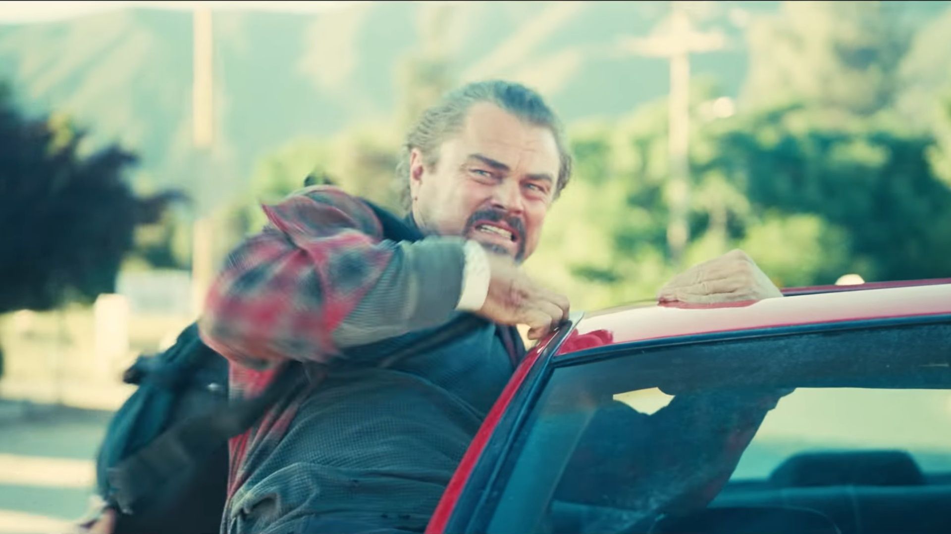 Leonardo DiCaprio in a tense action scene from One Battle After Another. (Image via Warner Bros)