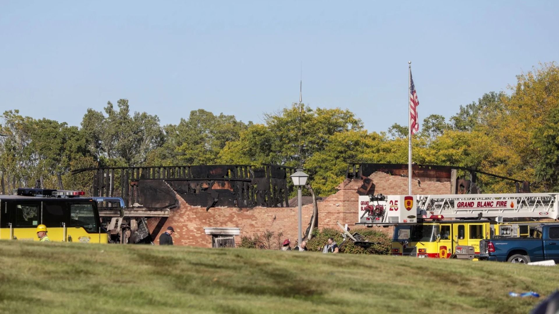 The burned church as emergency services respond to a shooting and fire at the Church of Jesus Christ of Latter-day Saints on September 28, 2025 in Grand Blanc, Michigan. Police said there are multiple victims and the shooter is down (Image via Getty)