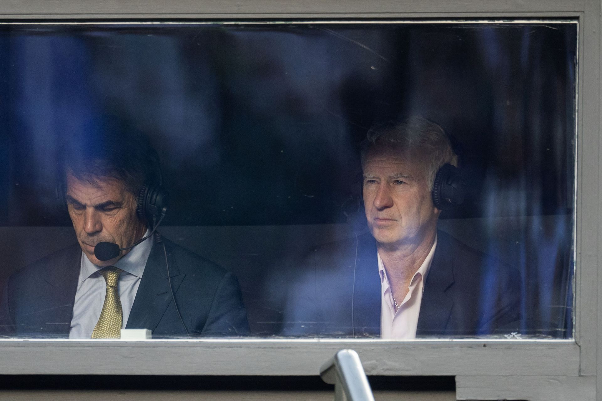 McEnroe in the commentary booth during a match in 2025. - Source: Getty