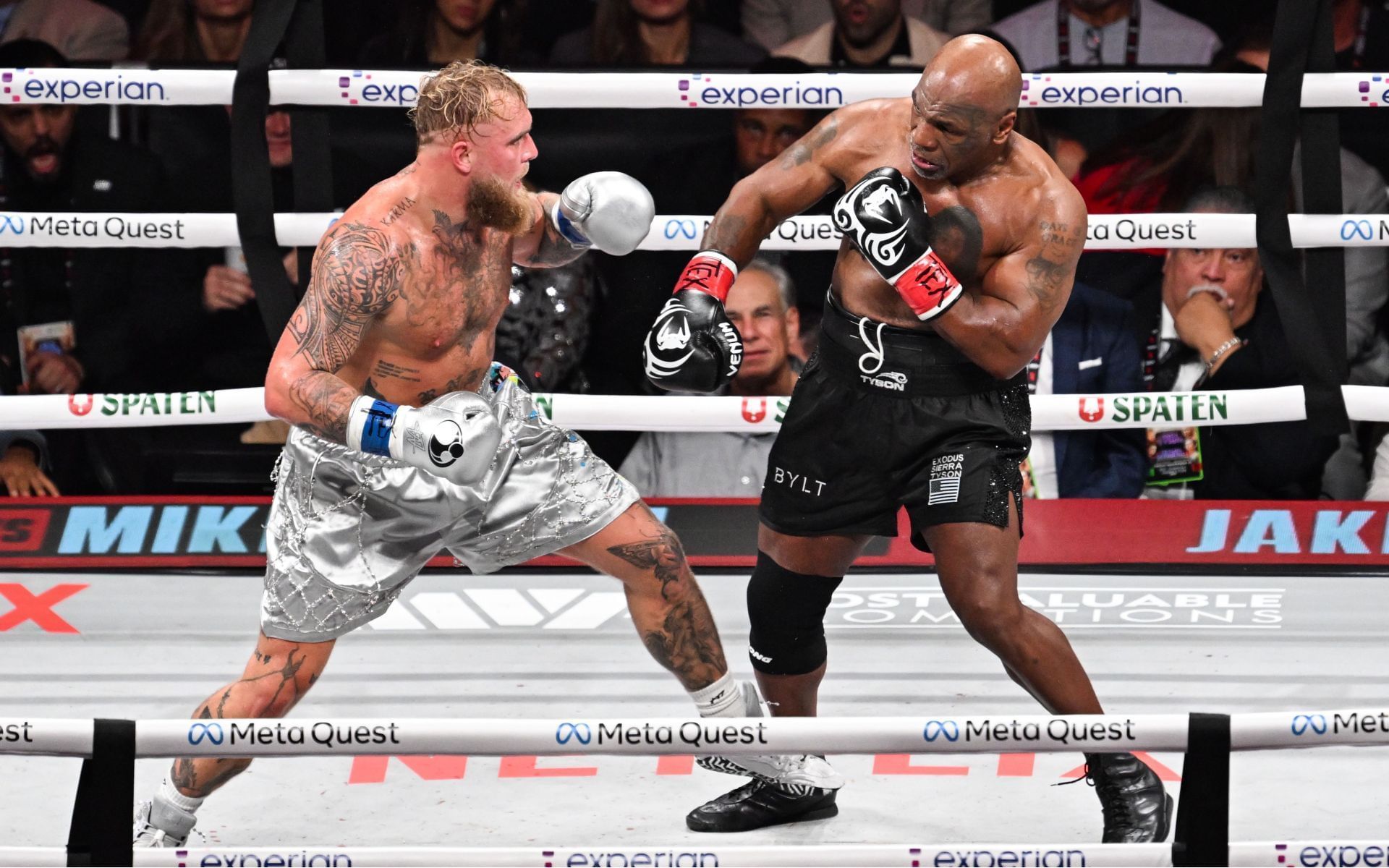 Former UFC champion reacts to Jake Paul (left) vs. Mike Tyson (right) post-fight interaction. [Images courtesy: Getty Images]