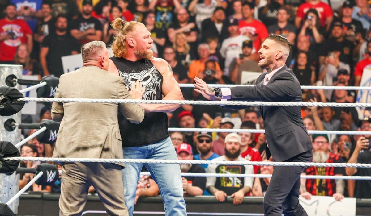 Brock Lesnar got his hands on the commentary team. (Image via WWE.com)