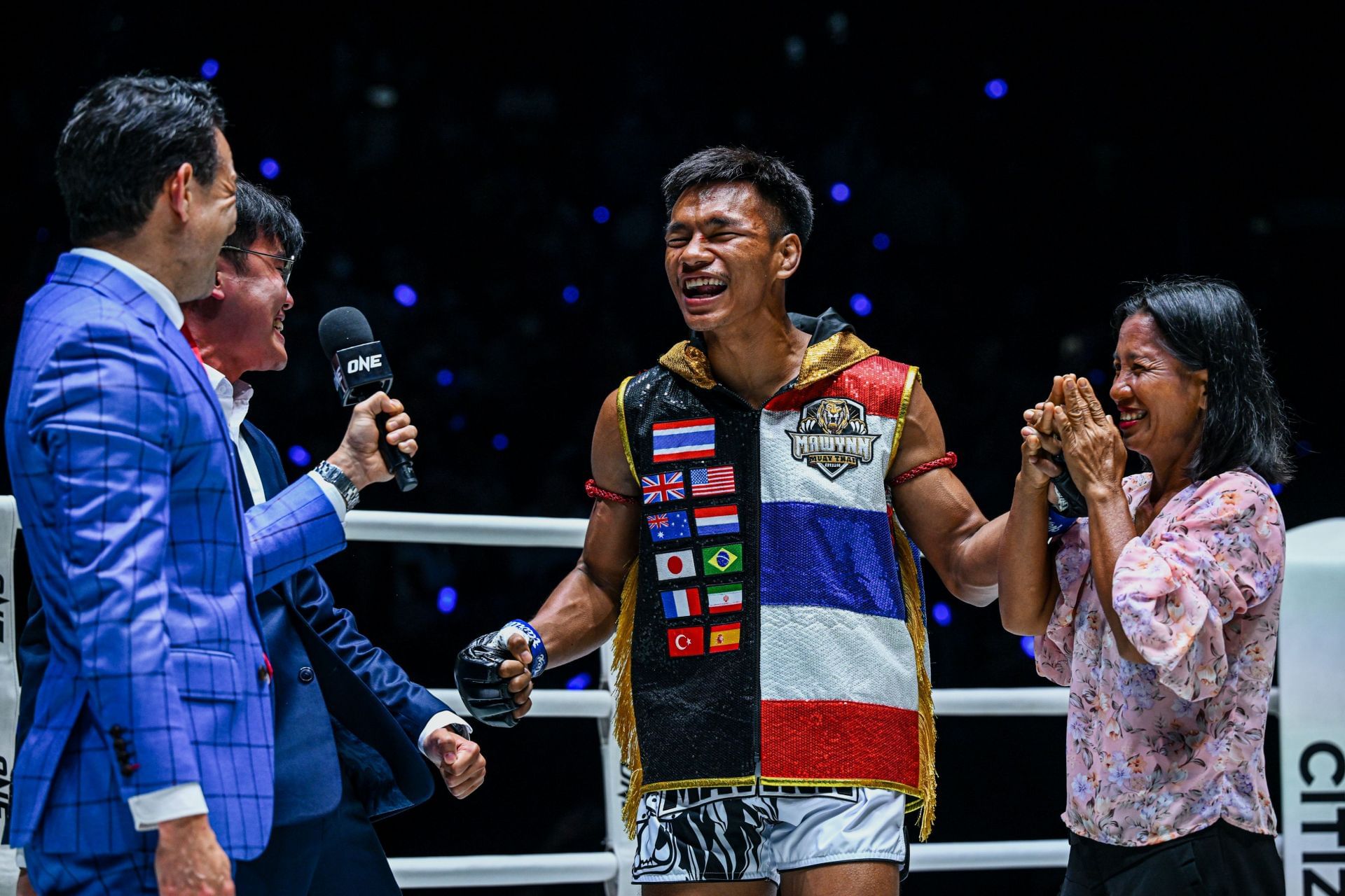 Shadow Singha Mawnn (center) celebrates his massive win on September 5. [Image: ONE Championship]