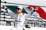 Pato O'Ward holding the Mexican flag after qualifying on the front row for the 109th Running Of The Indianapolis 500 - Source: Getty