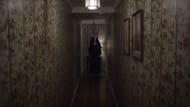 Valak appears in the hallway (Image via YouTube/Warner Bros.)