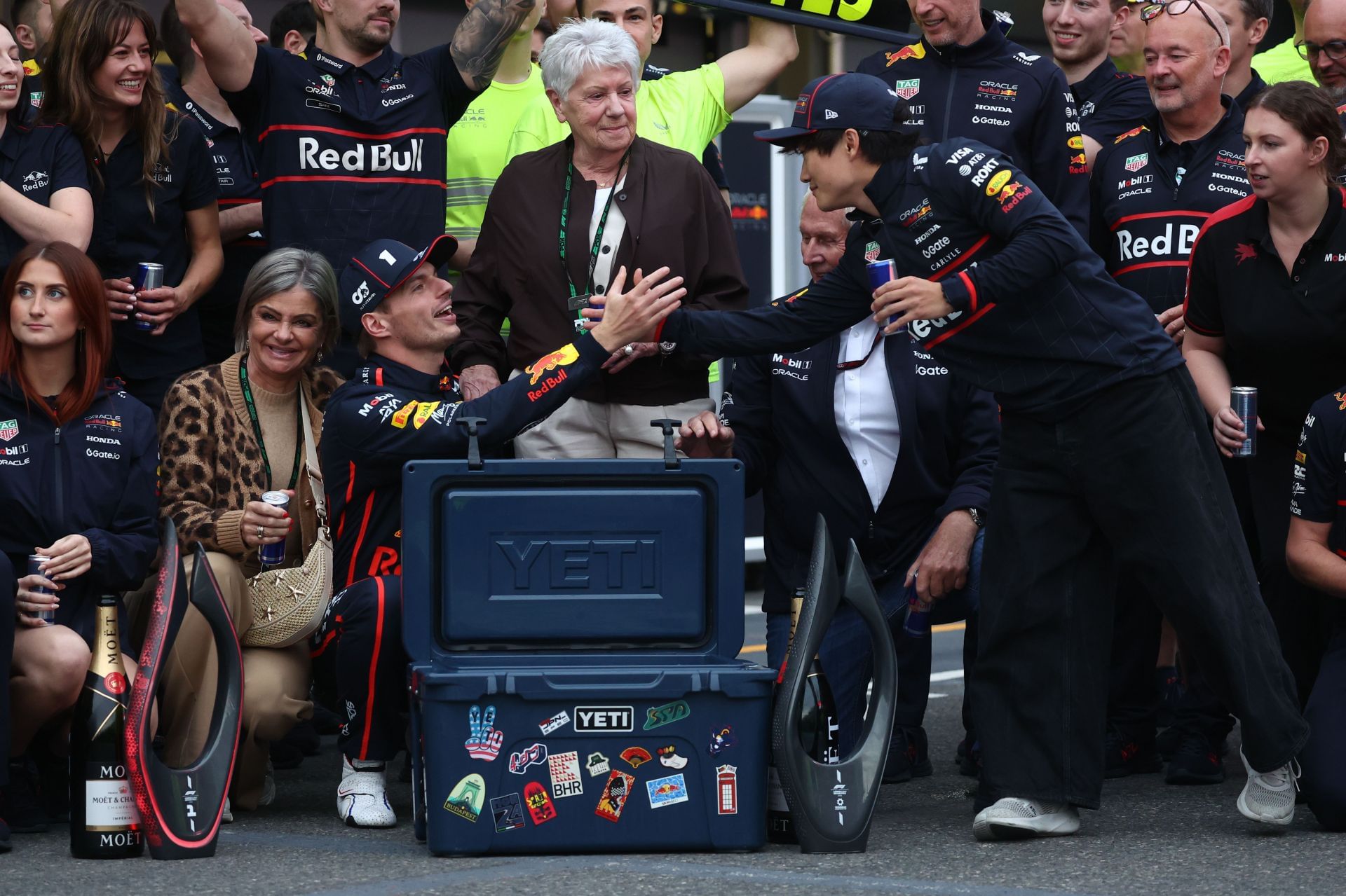 Red Bull&#039;s Max Verstappen and Yuki Tsunoda during the post-race celebrations in the pitlane after the F1 Grand Prix of Azerbaijan 2025 - Source: Getty