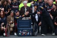 Red Bull's Max Verstappen and Yuki Tsunoda during the post-race celebrations in the pitlane after the F1 Grand Prix of Azerbaijan 2025 - Source: Getty