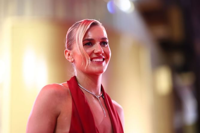 Ariarne Titmus steals the spotlight in red gown as she attends 2025 Brownlow Medal red carpet event