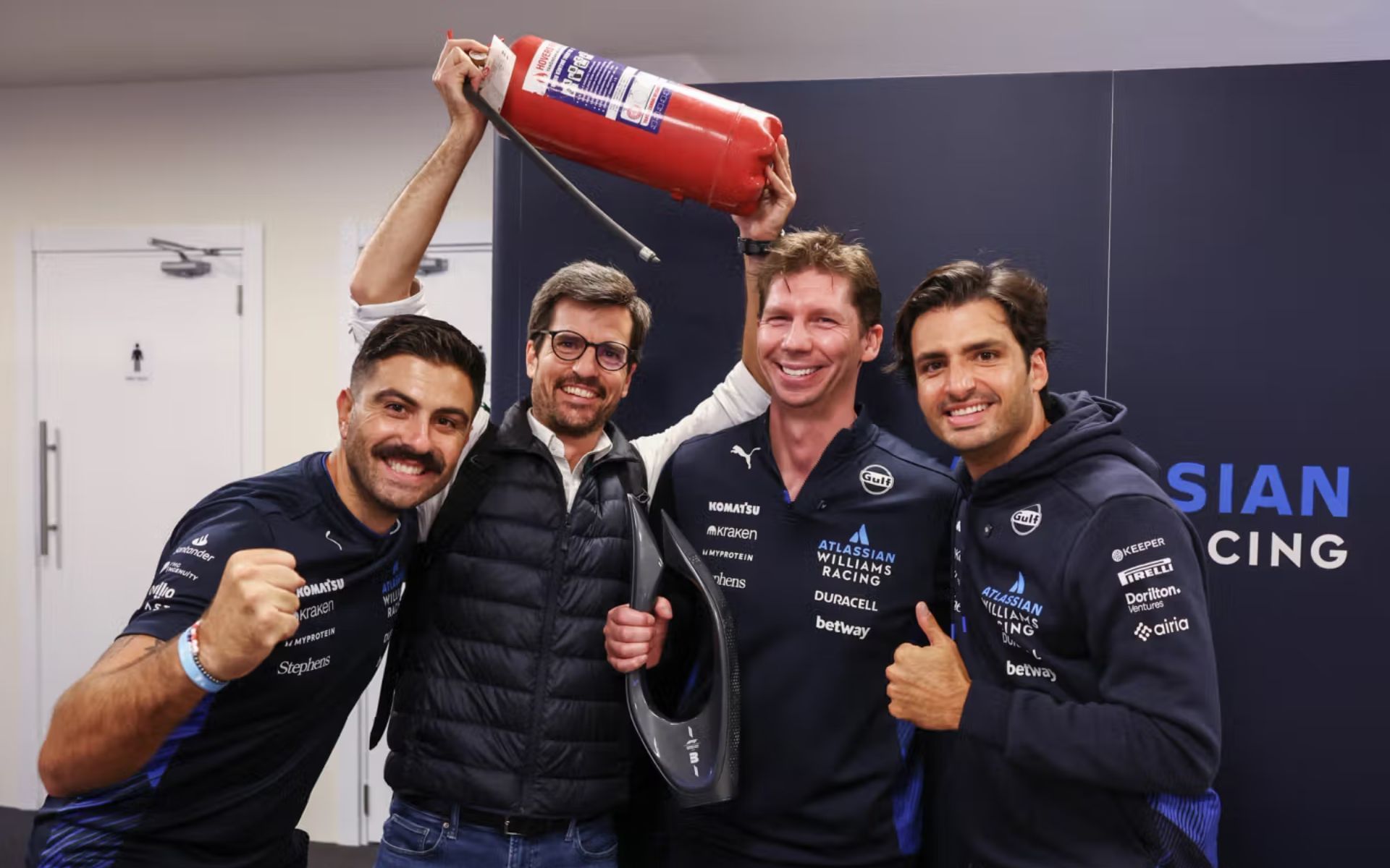 Pierluigi Della Bona, aka Gigi (L), Carlos Onoro, Carlos Sainz, James Vowles (R) celebrating Sainz
