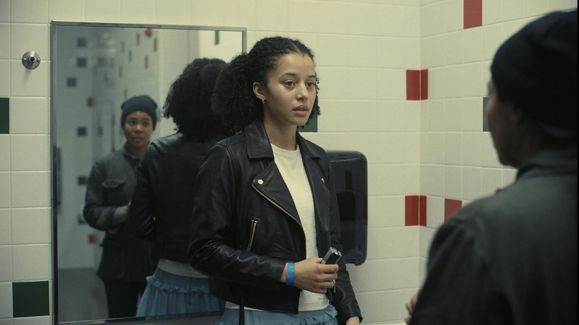 A tense scene from  featuring Chase Infiniti in a confrontation. (Image via Warner Bros)