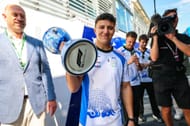 Racing Bulls' Isack Hadjar holding his third-place trophy for the Dutch GP in Monza, Italy - Source: Getty