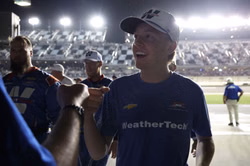 Connor Zilisch reacts to Parker Kligerman’s race-winning Daytona suit signed by Dale Jr. and JRM star