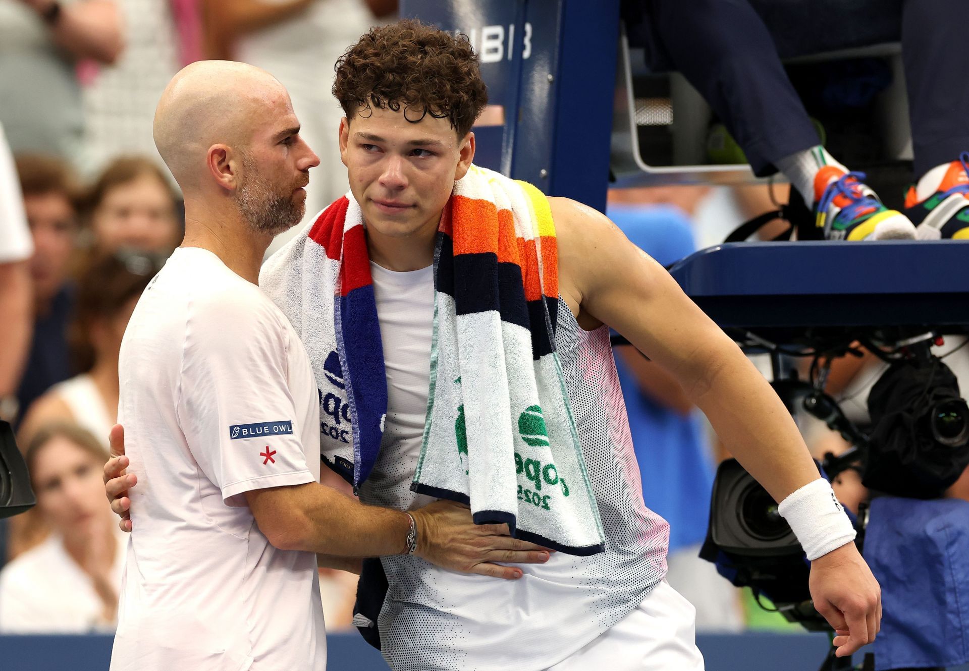 A tearful Ben Shelton (right) embraces opponent Adrian Mannarino (right) after retiring in the third round of men's singles action at the 2025 US Open (Source: Getty)