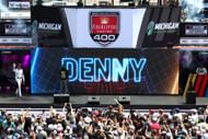 Denny Hamlin fans before the NASCAR Cup Series race at Michigan. Source: Getty