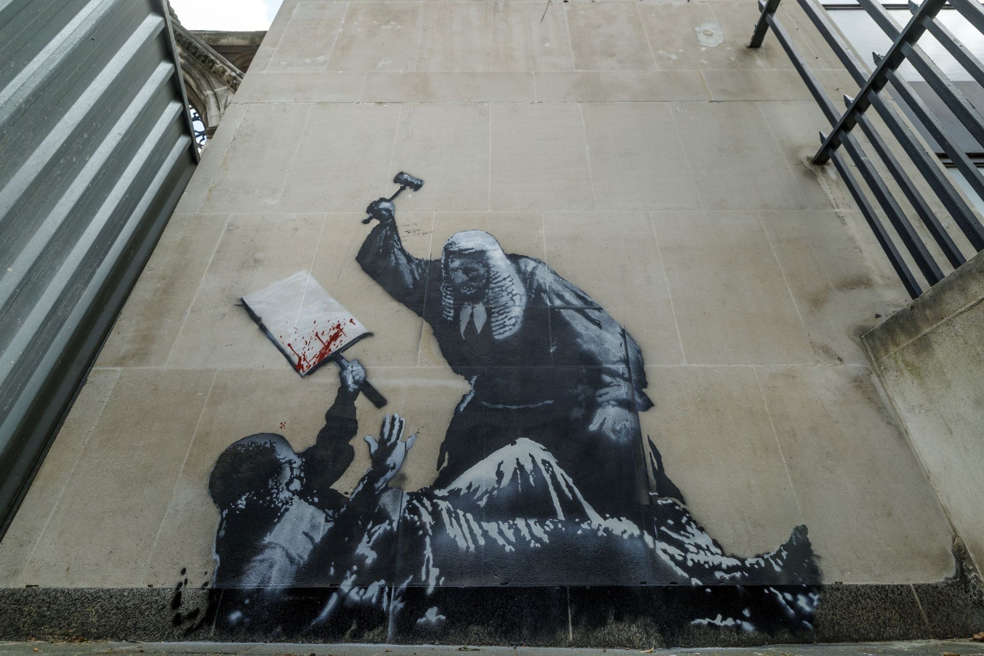 Latest Banksy Mural Covered And Guarded By Security At The Royal Courts Of Justice - Source: Getty