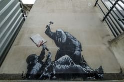Elon Musk criticizes the removal of Banksy's mural from the British Royal Courts of Justice, saying the more they cover it "the more it will appear"