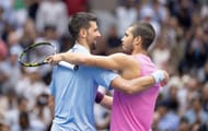 Novak Djokovic (left) embraces Carlos Alcaraz (right) after losing to the Spaniard in the men's singles semifinals of the 2025 US Open (Source: Getty)