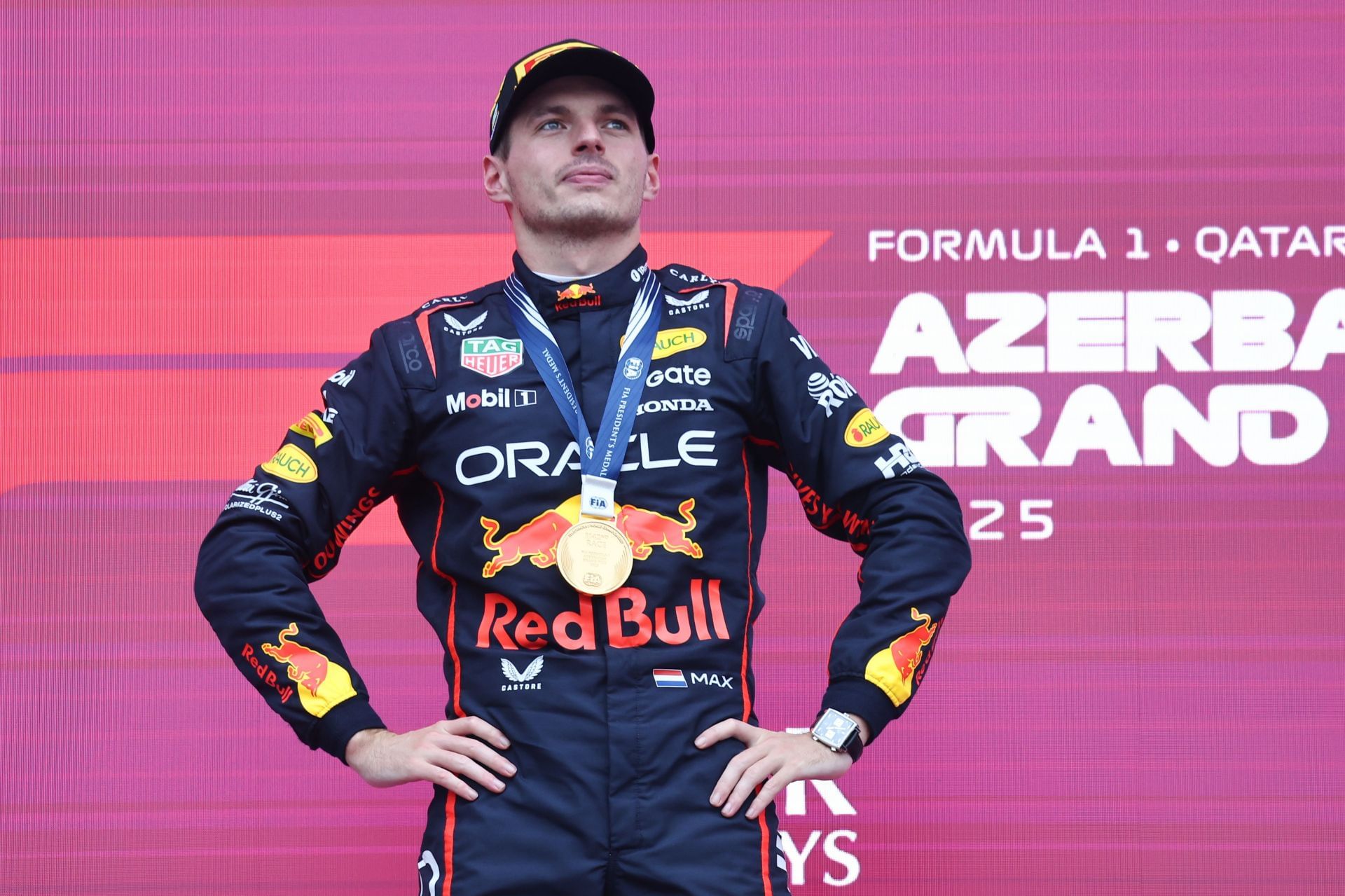 Red Bull&#039;s Max Verstappen standing atop the podium at the F1 Grand Prix of Azerbaijan 2025 - Source: Getty