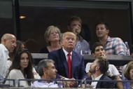 Donald Trump (center) watching the quarterfinal match between Venus and Serena Williams at the 2015 US Open (Source: Getty)