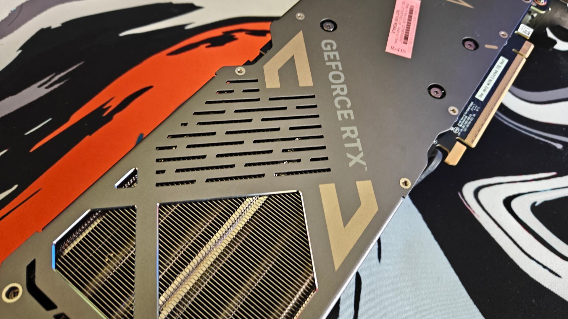 The Zotac Solid OC RTX 5070 ships with a muted gray-gold colorway (Image via Sportskeeda)