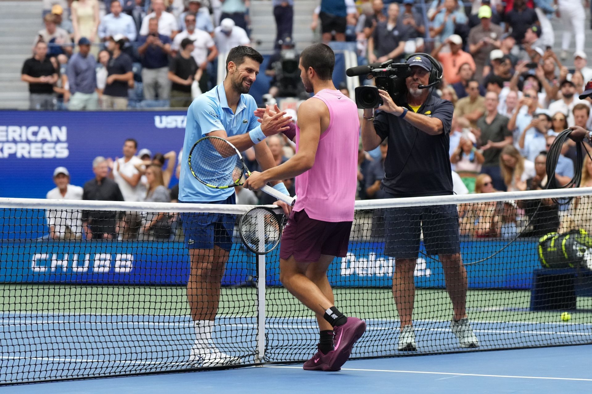 Novak Djokovic (left) shakes hands with Carlos Alcaraz (right) after losing to the Spaniard in the men&#039;s singles semifinals at the 2025 US Open (Source: Getty)