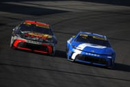 Chase Briscoe (19) and Denny Hamlin (11) during the NASCAR Cup Series. Source: Getty