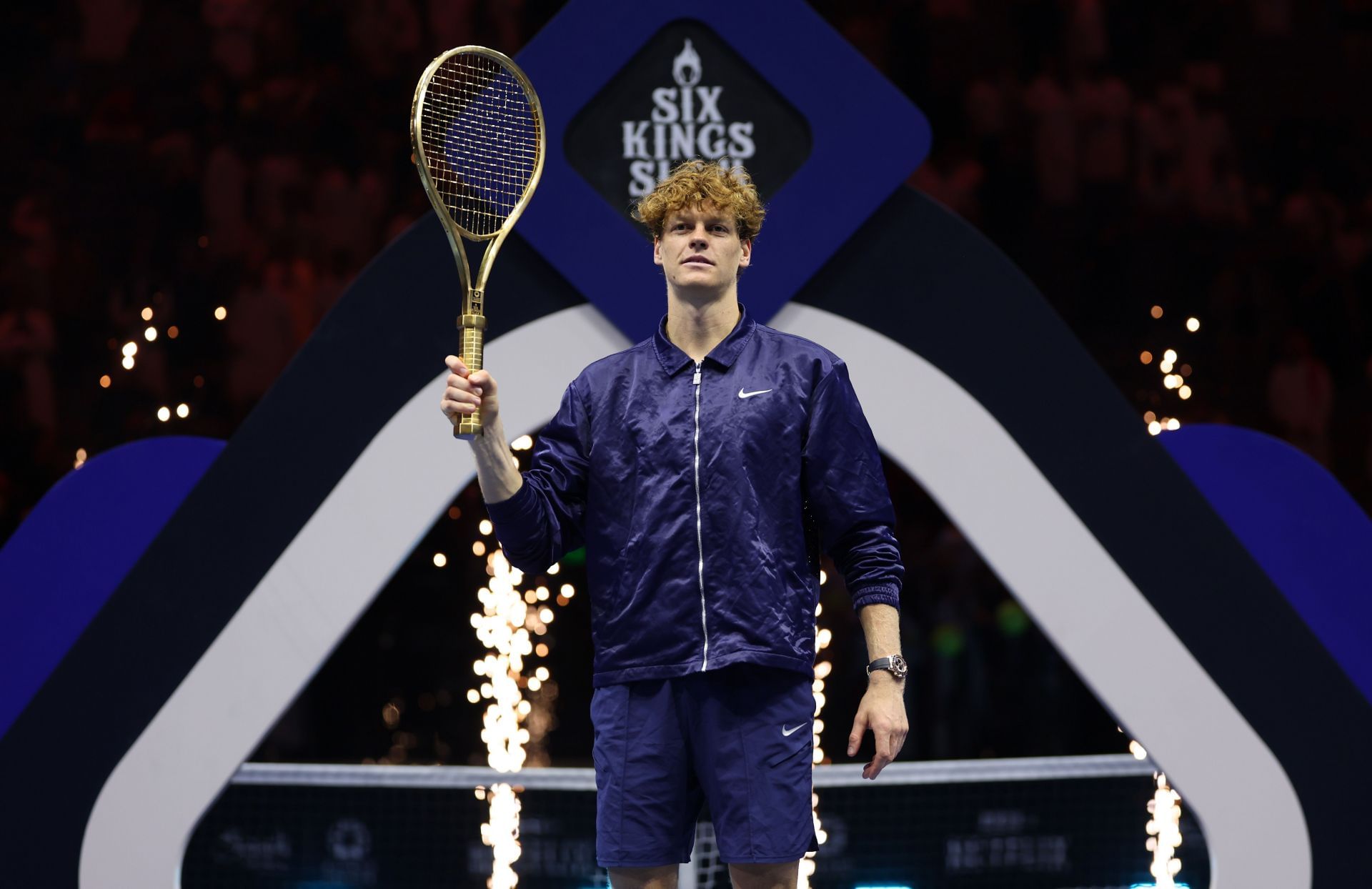 Jannik Sinner poses with the golden racket presented to him as the trophy for winning the 2025 Six Kings Slam (Source: Getty)