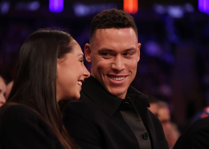 Aaron Judge’s walk-up lyric comes to life as he and wife Samantha chill courtside with Carmelo Anthony at Knicks game