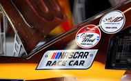 Kyle Busch (18) honoring the lives of car owner Glenn Wood and son JD Gibbs. Source: Imagn