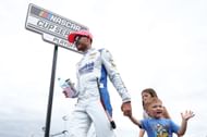 Kyle Larson with son Cooper and daughter Audrey at Charlotte Motor Speedway. Source: Getty