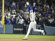Freddie Freeman celebrates after hitting a walk-off home run in the 18th inning against the Toronto Blue Jays to win game 3 of the World Series - Source: Getty