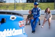 Kyle Larson with his children at Iowa Speedway, June 16, 2024. Source: Imagn