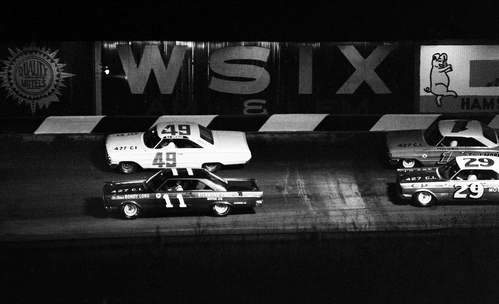 Ned Jarrett (11) leads in the 1965 Grand National race at Fairgrounds Speedway. Source: Imagn