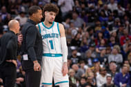 Feb 24, 2025; Sacramento, California, USA; Charlotte Hornets head coach Charles Lee talks with guard LaMelo Ball (1) during a time out in the fourth quarter of the game against the Sacramento Kings at Golden 1 Center. Mandatory Credit: Ed Szczepanski-Imagn Images