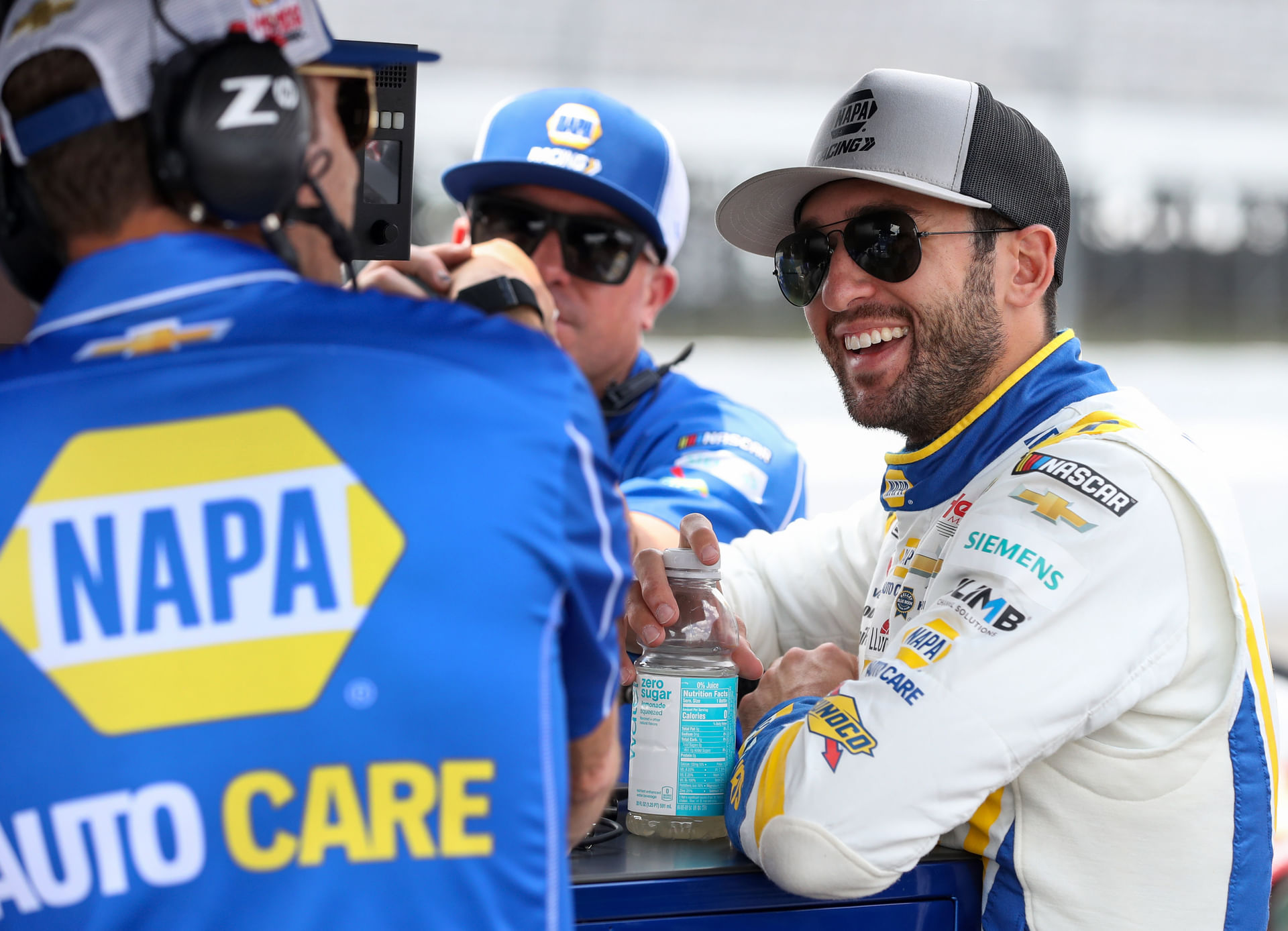 Chase Elliott (R) with the Hendrick Motorsports crew at Pocono Raceway. Source: Imagn