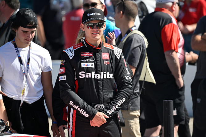 Corey Heim reacts to his rookie NASCAR teammate's maiden Truck victory