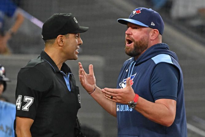"MLB wants Jays to win"; "Brutal" - Fans accuse umps of favoring Blue Jays after controversial call in ALCS showdown vs. Mariners