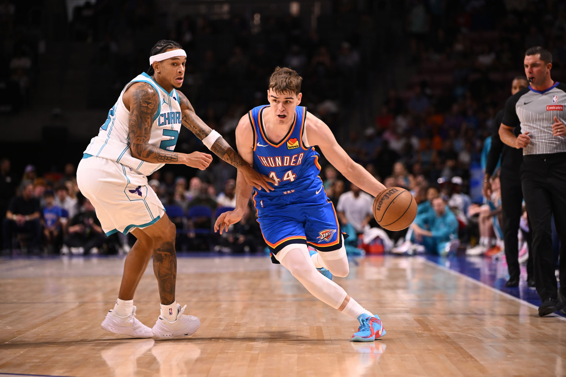 Oklahoma City Thunder guard Nikola Topic (44) drives up the court against the Charlotte Hornets in the first quarter at North Charleston Coliseum. Mandatory Credit: Arthur Ellis-Imagn Images