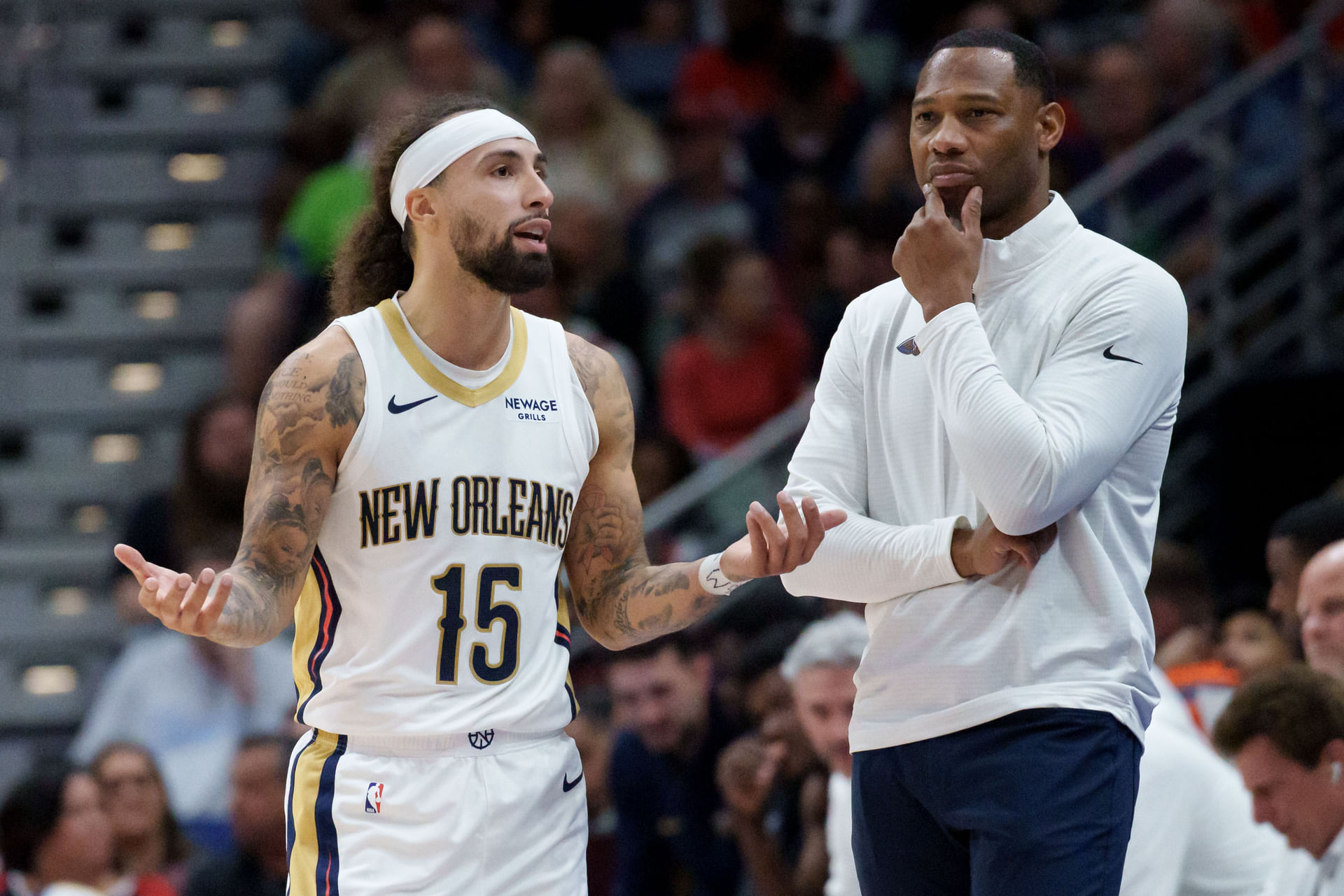 Oct 27, 2025; New Orleans, Louisiana, USA; New Orleans guard Jose Alvarado (15) talks with head coach Willie Green during the second half against the Boston Celtics at Smoothie King Center. Mandatory Credit: Matthew Hinton-Imagn Images