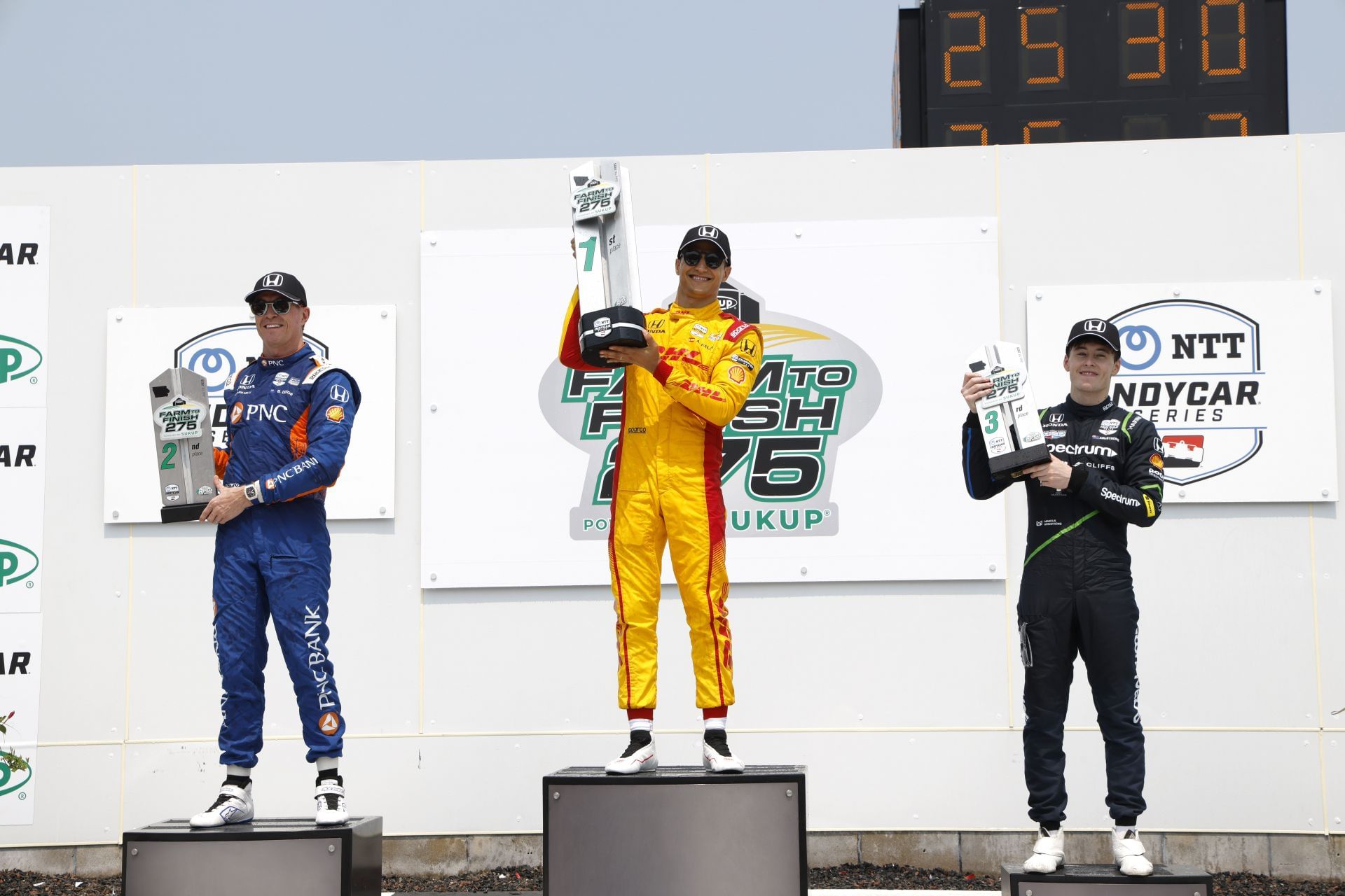 Scott Dixon, Alex Palou, and Marcus Armstrong on the podium at the IndyCar Iowa Race Weekend - Source: Getty