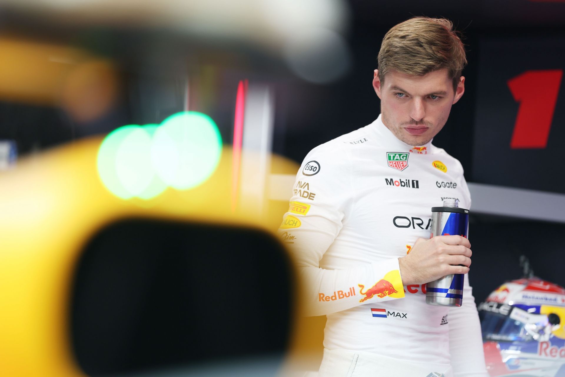 Max Verstappen looking at his Red Bull RB21 ahead of the qualifying session for the 2025 F1 Grand Prix of Singapore - Source: Getty