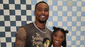 Simone Biles poses in all black outfit while husband Jonathan Owens rocks Versace shirt for special date night