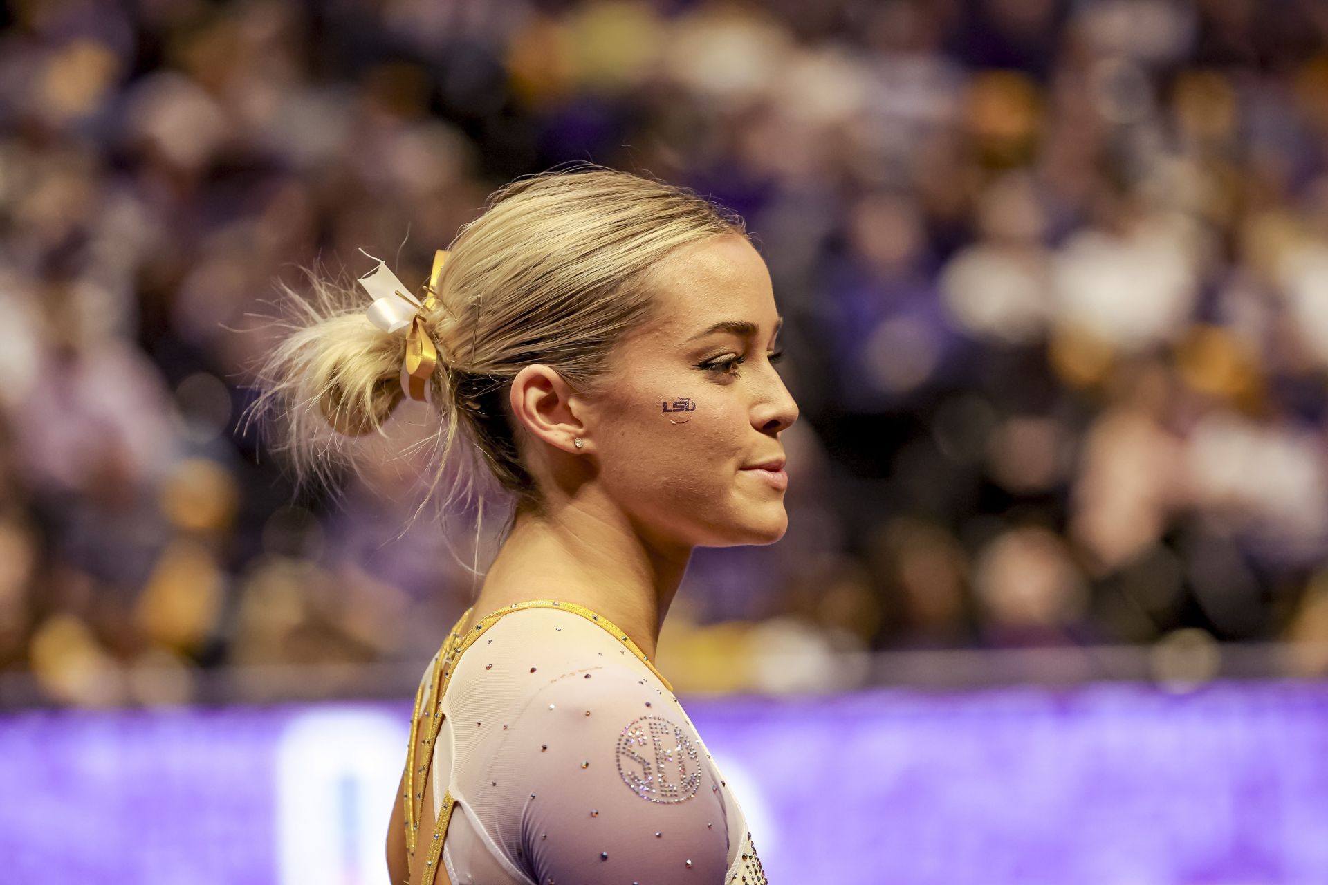 Dunne at an Iowa State vs LSU meet (Image Source: Getty)