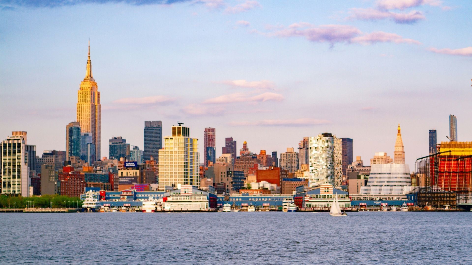 City skyline of New Jersey, as seen from a Boardwalk (Image via Manisha Raghunath/Unsplash)