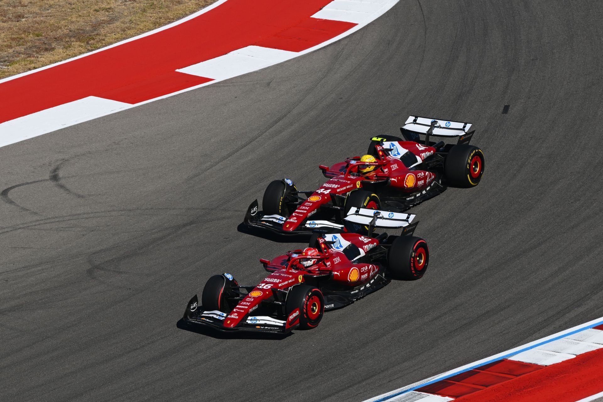 Charles Leclerc of Monaco driving the (16) Scuderia Ferrari SF-25 leads Lewis Hamilton of Great Britain driving the (44) Scuderia Ferrari SF-25  - Source: Getty