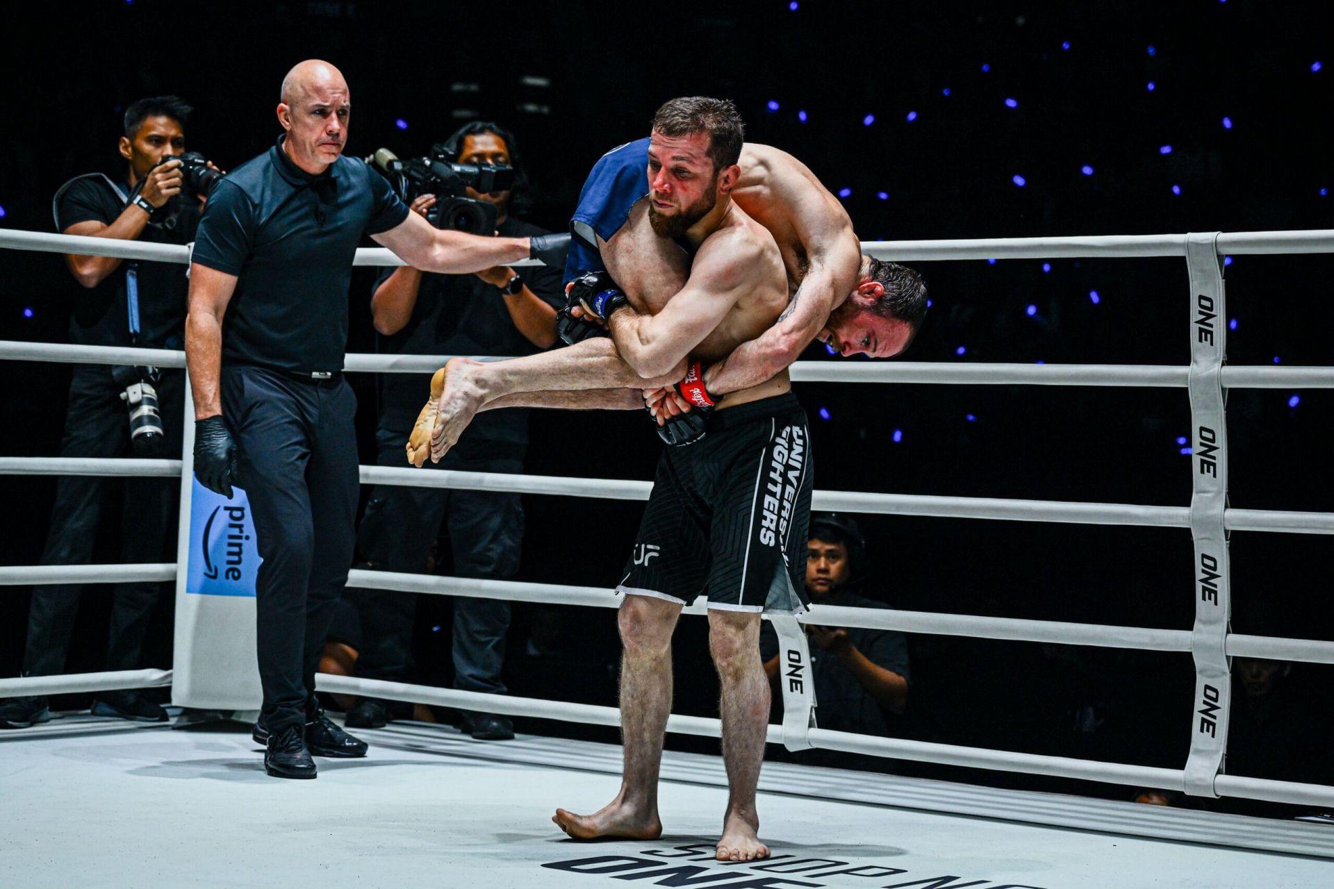 Mansur Malachiev picks up Jarred Brooks | Image by ONE Championship